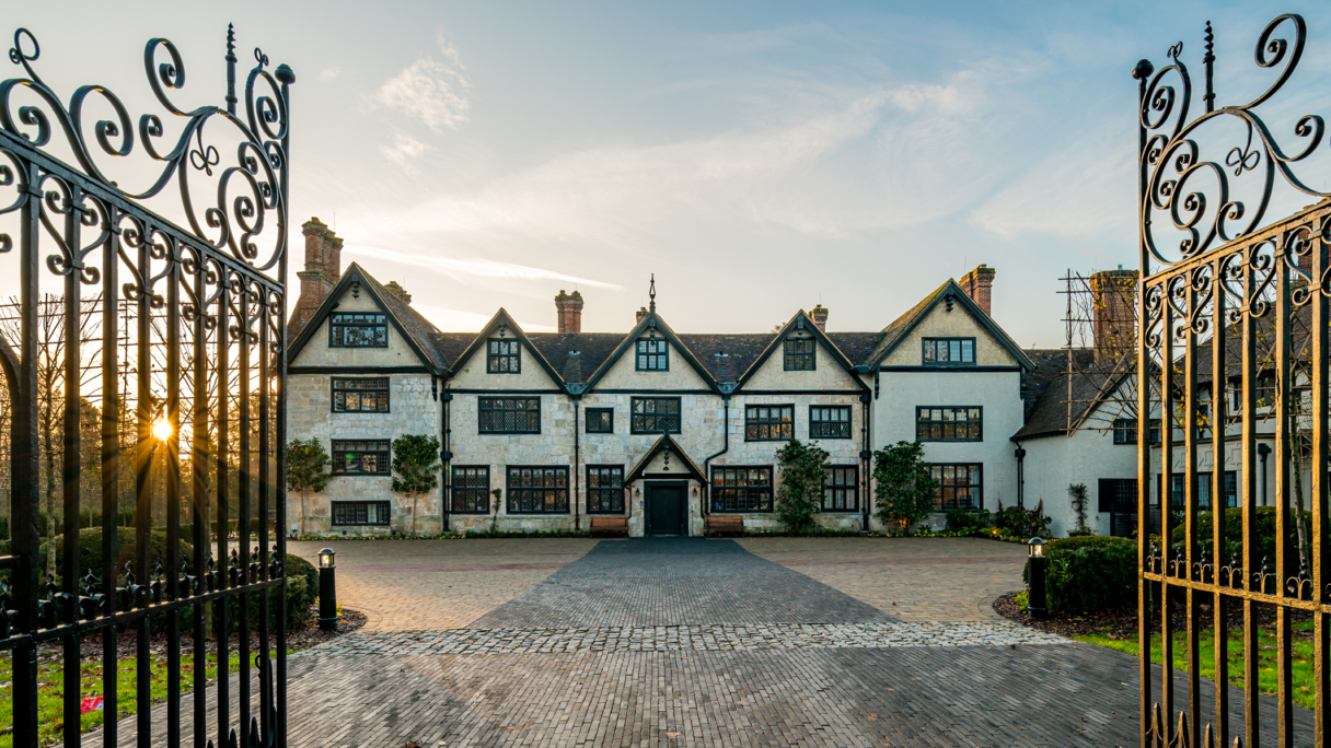 Large house with gates in the sunshine